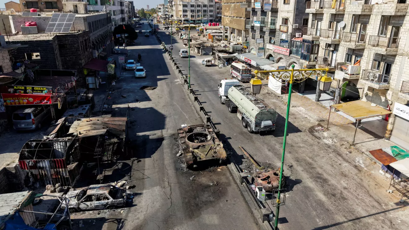 A drone view shows the remains of a destroyed tank, following deadly clashes between Druze fighters, Sunni Bedouin tribes and government forces, in Syria's predominantly Druze city of Sweida, Syria July 25, 2025. Reuters/Khalil Ashawi
