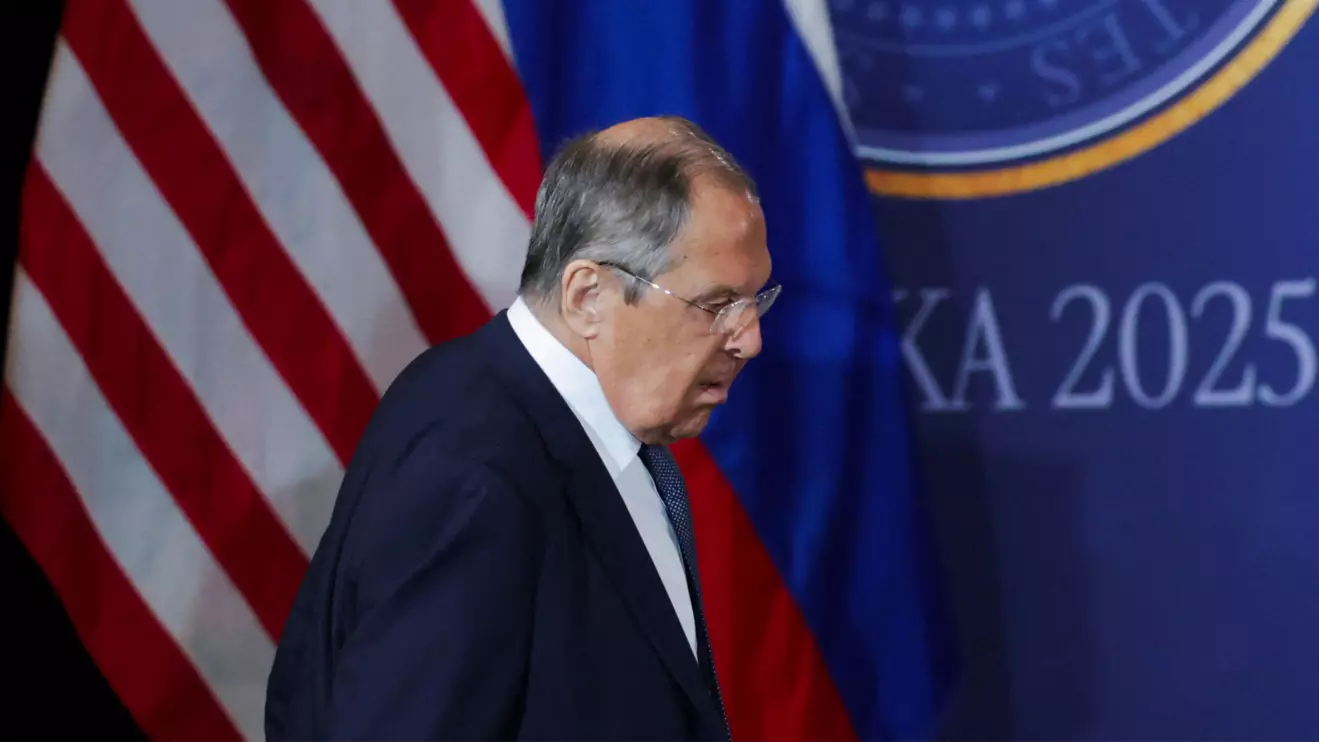 Russian Foreign Minister Sergei Lavrov walks ahead of a joint press conference by U.S. President Donald Trump and Russian President Vladimir Putin, following their meeting to negotiate an end to the war in Ukraine, at Joint Base Elmendorf-Richardson in Anchorage, Alaska, U.S., August 15, 2025. Reuters/Jeenah Moon