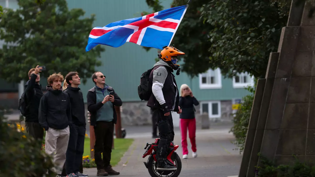 A man with an Icelandic flag rolls around in a park ahead of a referendum on whether Iceland should resume accession negotiations with the European Union, in Reykjavik, Iceland, August 29, 2026. Reuters/Leonhard Foeger