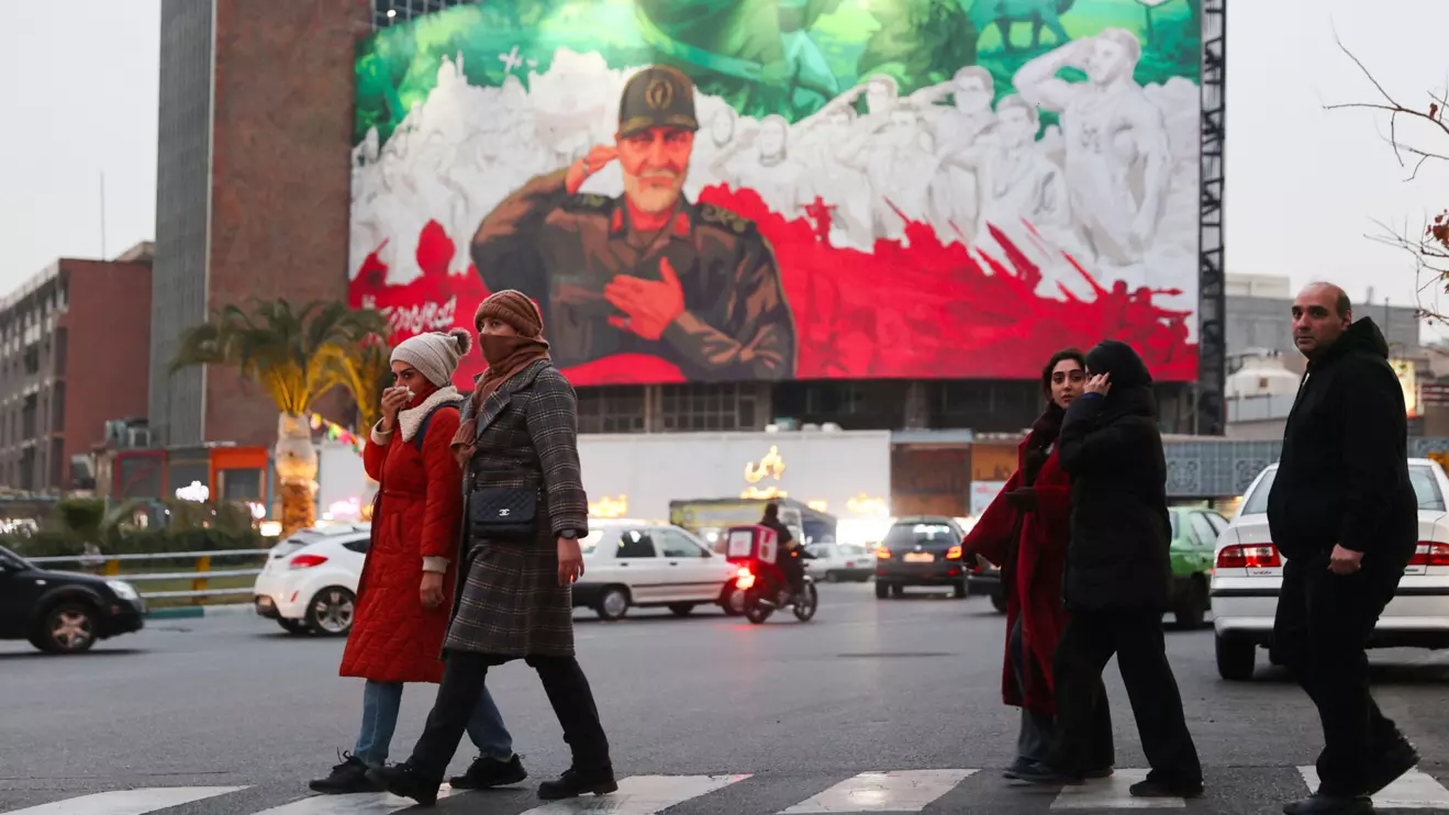 People walk on a street as protests erupt over the collapse of the currency's value in Tehran, Iran, January 2, 2026. Majid Asgaripour/WANA (West Asia News Agency) via Reuters