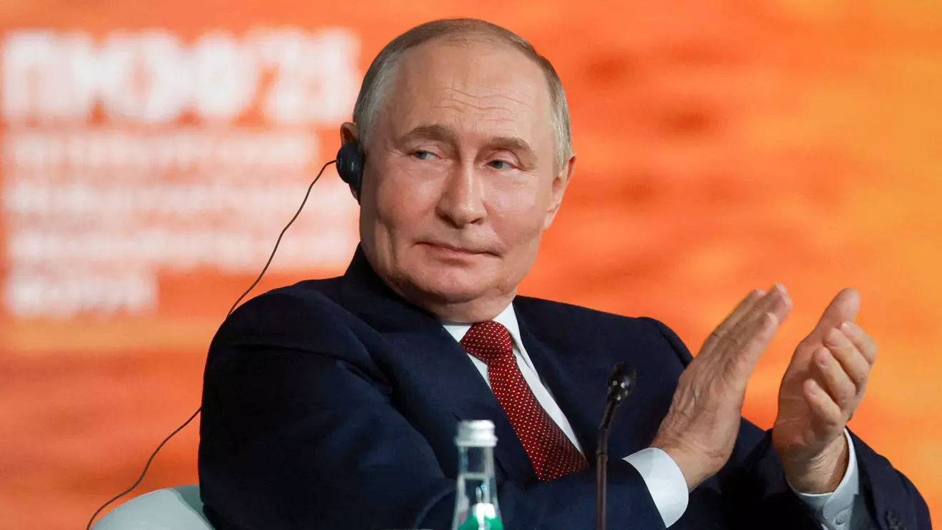 Russia's President Vladimir Putin applauds during a plenary session of the St. Petersburg International Economic Forum (SPIEF) in Saint Petersburg, Russia, June 20, 2025. Reuters/Anton Vaganov
