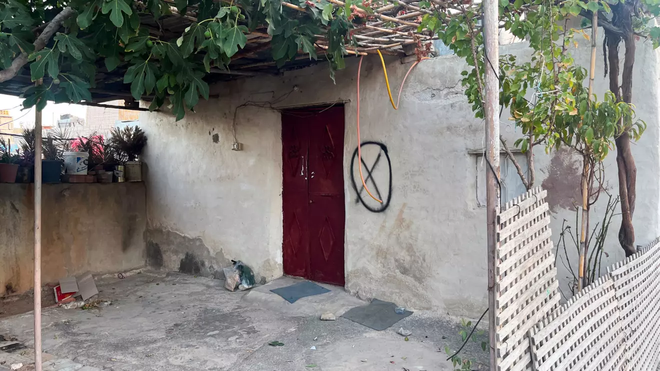 A house is marked with X and O symbols as Syrian authorities carry out eviction orders in the predominantly Alawite neighbourhood of al-Somaria, in Damascus, Syria, August 29, 2025. Reuters/Feras Dalatey