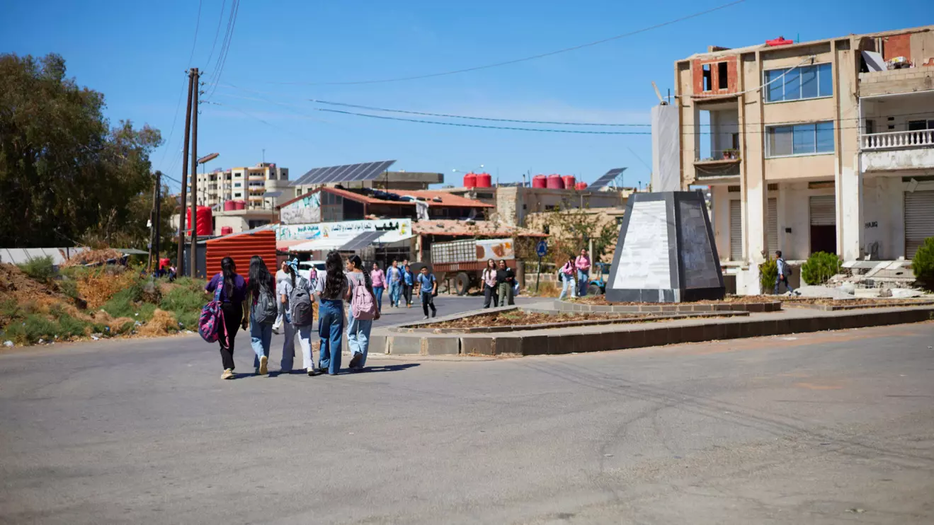 A group of students walk along a street in the city of Shahba, Sweida province, Syria, September, 26, 2026. Reuters/Kinan hlal