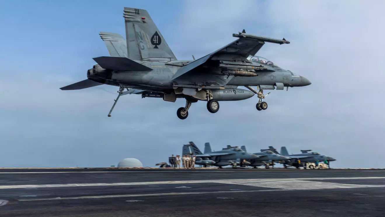 An F/A-18F Super Hornet, assigned to Strike Fighter Squadron 41, prepares to make an arrested landing on the flight deck of Nimitz-class aircraft carrier USS Abraham Lincoln during the ongoing conflict with Iran August 4, 2026. U.S. Navy