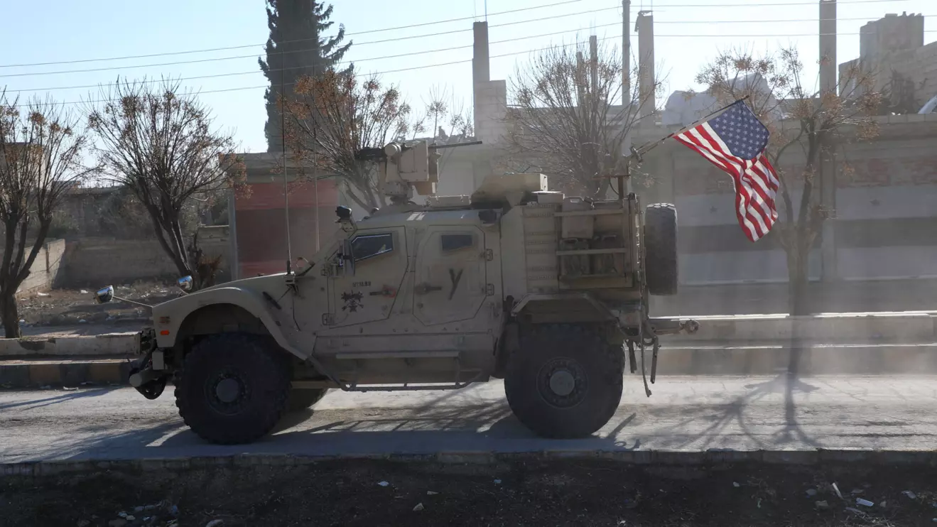 A U.S. military vehicle moves on a road on the day of a meeting between the Syrian Democratic Forces (SDF) leaders and U.S. military leaders, in Deir Hafer, Syria. January 16, 2026. Reuters/Orhan Qereman
