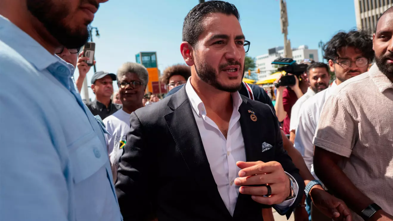 Abdul El-Sayed, winner of Michigan U.S, Democratic primary, is escorted out following a press conference in Detroit, Michigan, U.S. August 5, 2026. Reuters/Rebecca Cook