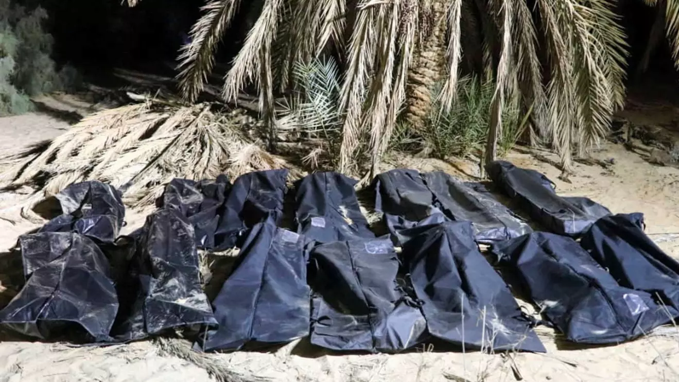 Bodies of migrants lie in bags, after they were discovered in a mass grave in a farm in Jikharra area, some 441 km from Benghazi, in Jikharra, Libya, February 5, 2025. Alwahat district Security Directorate/Handout via Reuters