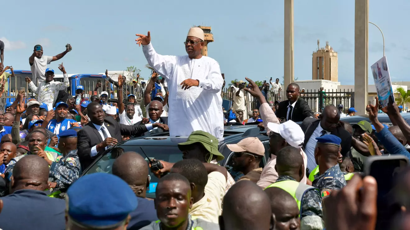 Former Senegalese President Macky Sall gestures to supporters after returning to Senegal to meet with his successor, President Bassirou Diomaye Faye, as part of Sall's campaign for the post of United Nations secretary-general, in Dakar, Senegal, July 17, 2026. Reuters/Alioune Seye