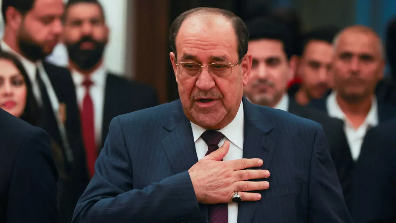 Former Iraqi Prime Minister Nouri al-Maliki gestures as he arrives to vote during Iraq's provincial council elections, at a polling station in Baghdad, Iraq, December 18, 2023. Reuters/Ahmed Saad