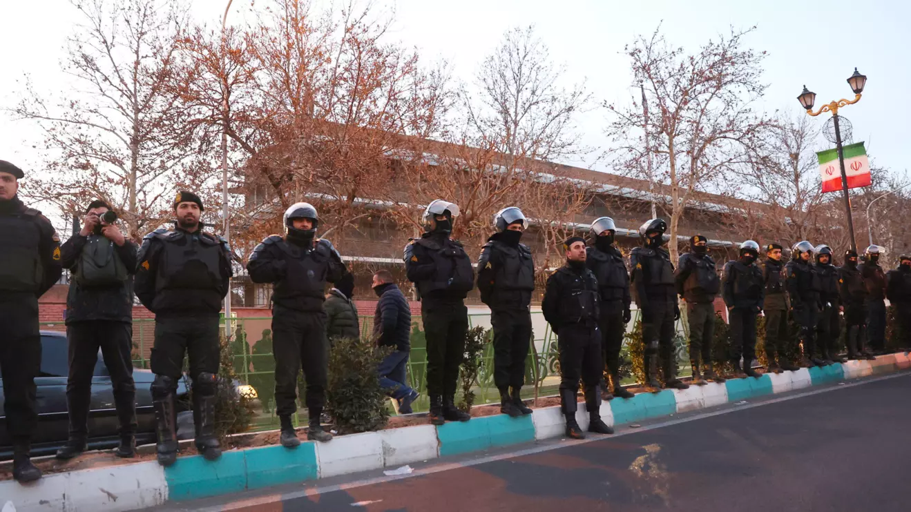 Members of the Iranian police stand guard at a protest in front of the British embassy following anti-government protests in Tehran, Iran, January 14, 2026. Majid Asgaripour/WANA (West Asia News Agency) via Reuters