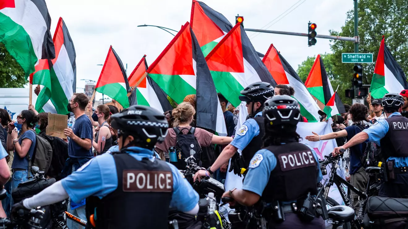 Police officers next to demonstrators after a pro-Palestinian encampment was dismantled in Chicago, Illinois, U.S., May 16, 2024. Reuters/Jim Vondruska