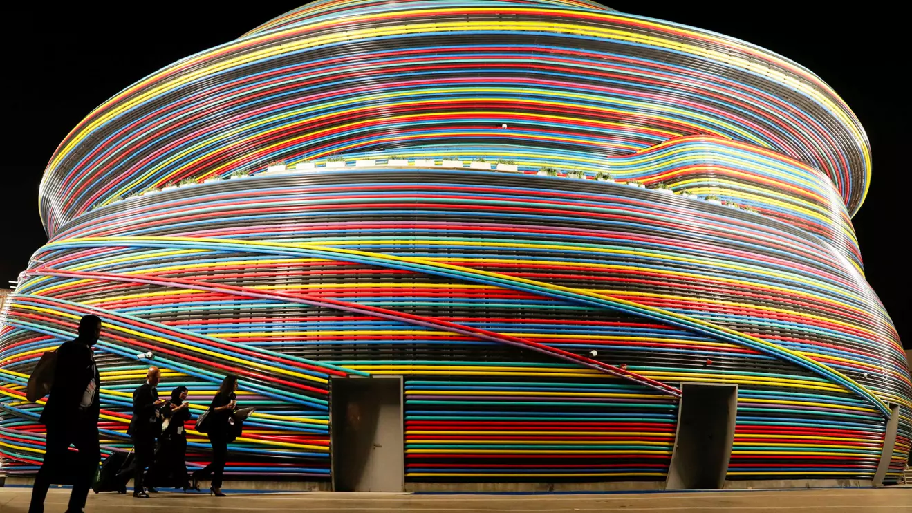 Delegates walk in front of the Russia Pavillion building at Dubai's Expo City during the United Nations Climate Change Conference (COP28) in Dubai, United Arab Emirates, December 6, 2023. Reuters/Thomas Mukoya
