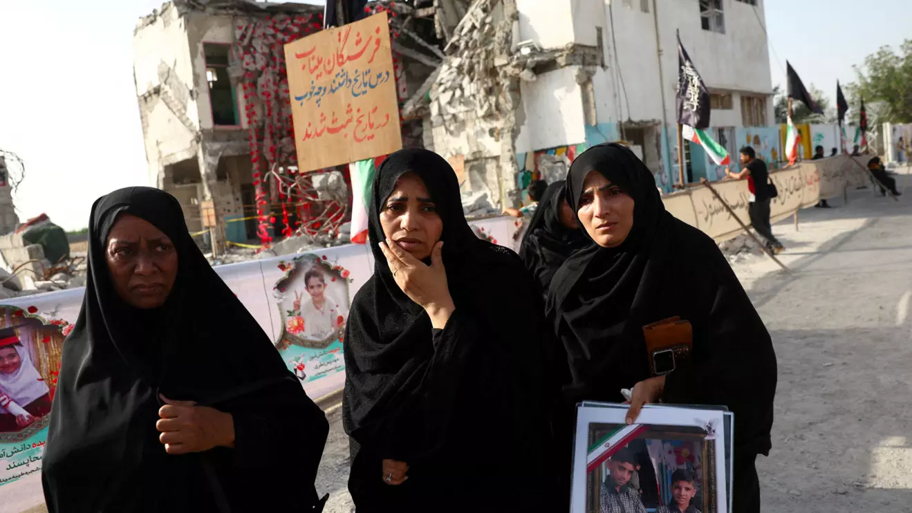 Raheleh, an Iranian woman who lost two of her children in Minab school strike on February 28, reacts at Minab school in Minab, Iran, May 21, 2026. Majid Asgaripour/WANA (West Asia News Agency) via Reuters