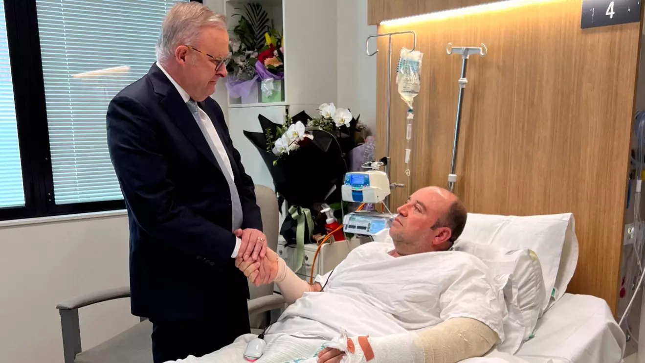 Australia's Prime Minister Anthony Albanese visits Ahmed al Ahmed, the bystander who charged at one of the gunmen and seized his rifle during the deadly shooting at Bondi Beach, at St George Hospital in Sydney, Australia. Prime Minister's Office