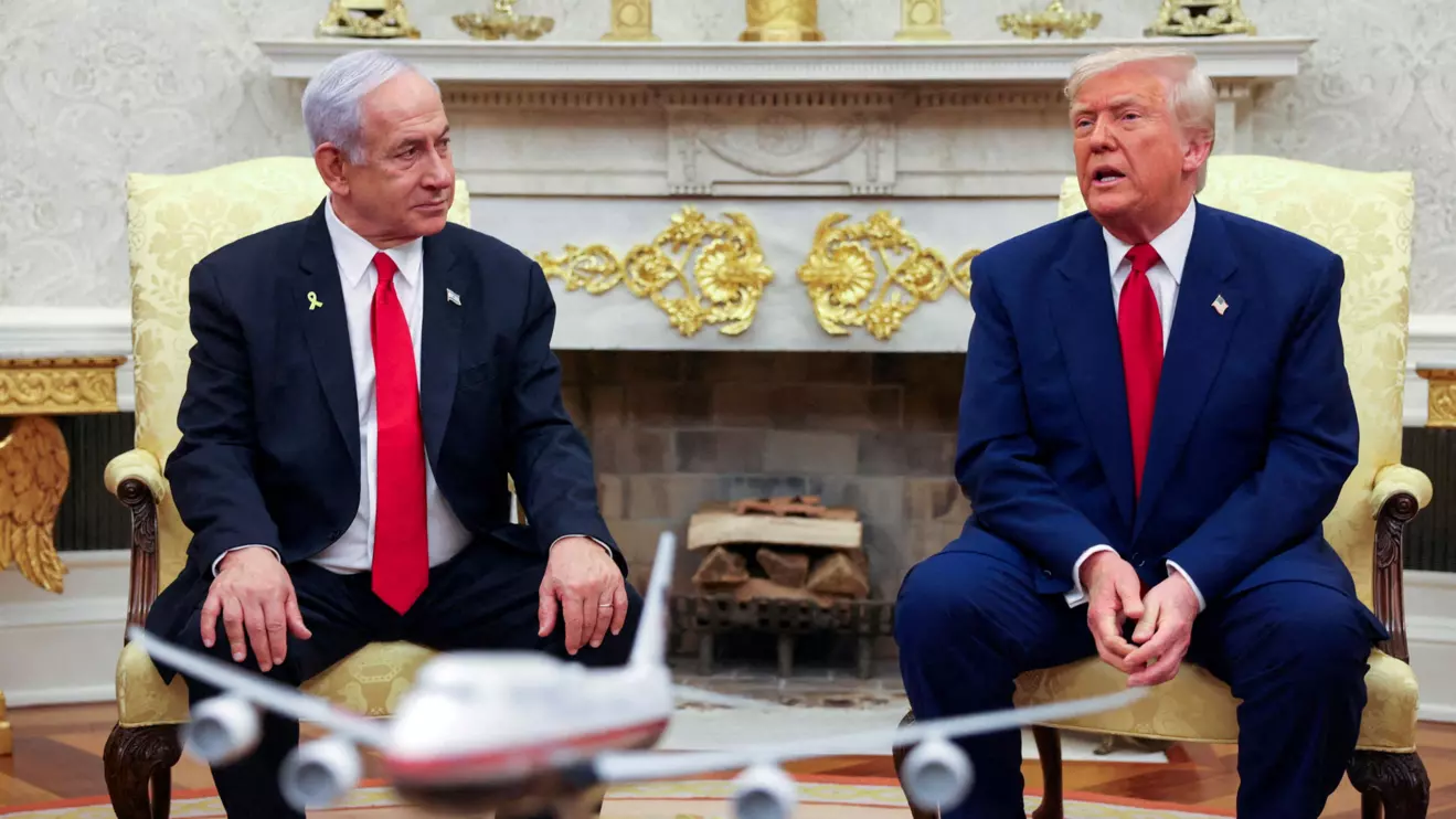 U.S. President Donald Trump talks to Israeli Prime Minister Benjamin Netanyahu during a meeting where Trump announced nuclear talks with Iran, Washington, U.S., April 7, 2025. Reuters/Kevin Mohatt