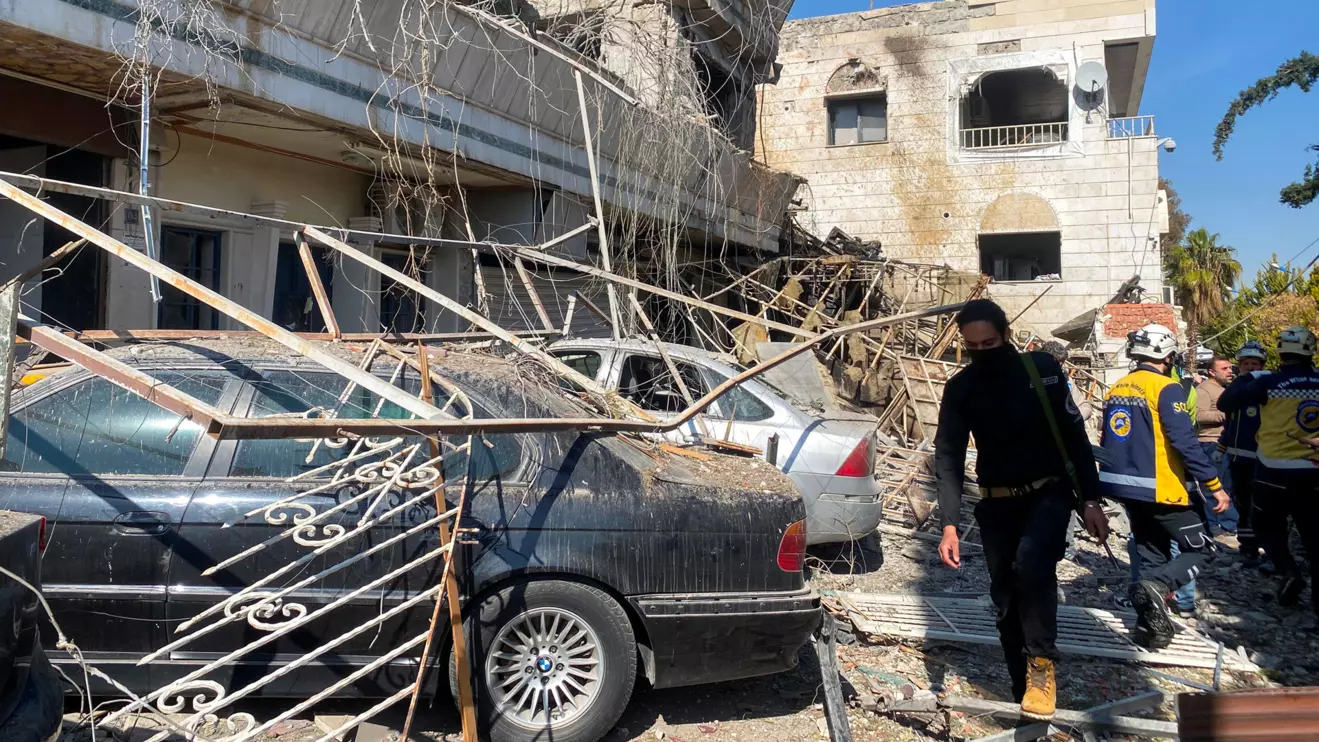 Civil defence members stands near a damaged site, after Israeli aircraft targeted a building on the edge of Damascus on Thursday, as reported by Syria's state news agency,in Damascus, Syria March 13, 2025. Reuters/Firas Makdesi