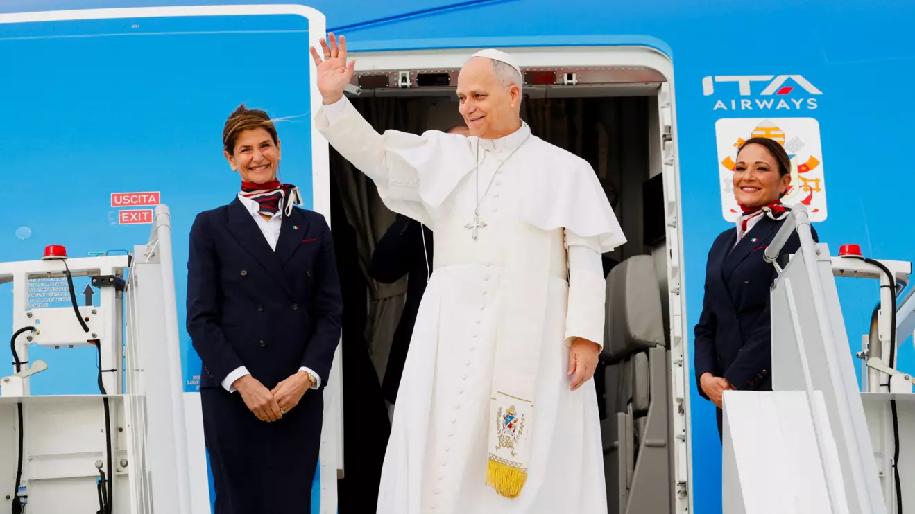 Pope Leo XIV waves as he boards the papal plane ahead of his first apostolic journey to Algeria, Angola, Cameroon and Equatorial Guinea, at Fiumicino Airport, near Rome, Italy, April 13, 2026. Reuters/Remo Casilli