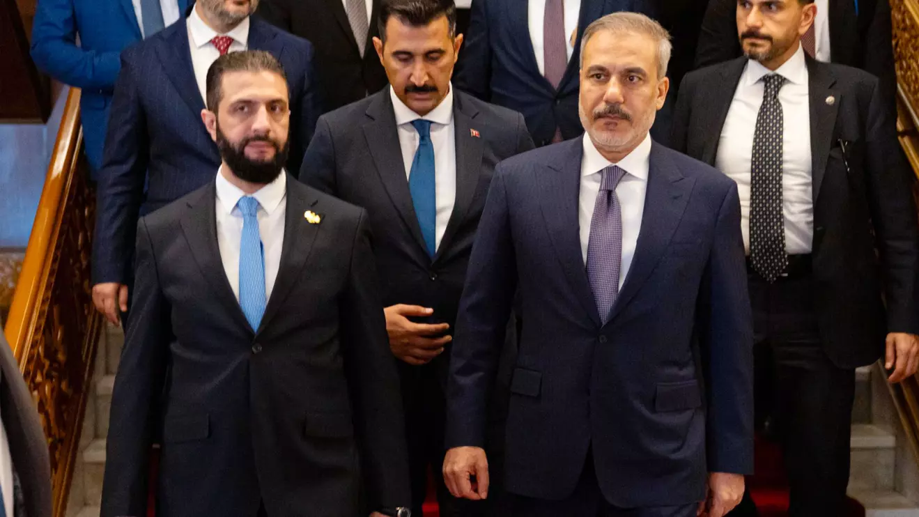 Ahmad al-Sharaa (L) and Hakan Fidan on Thursday in Damascus © X