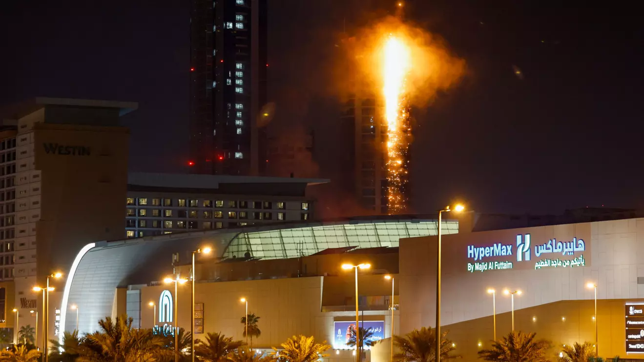 Smoke rises from a burning building hit by an Iranian drone strike, after Israel and the U.S. launched strikes on Iran, in Seef district, Manama, Bahrain, February 28, 2026. Reuters