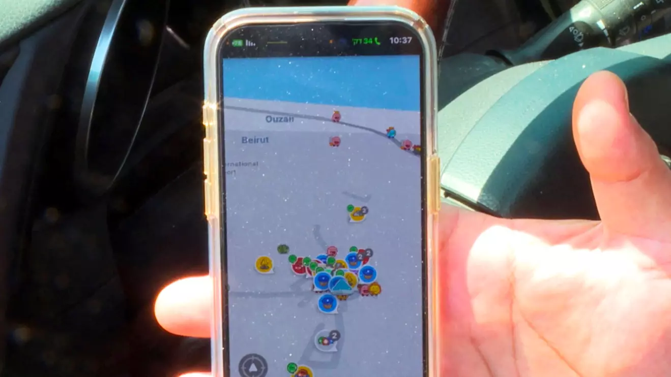 An Israeli driver uses Waze, an Israeli mobile satellite navigation application showing his location as near Beirut in Lebanon, amid concerns of a possible escalation in violence after the killing of Iranian generals in Damascus, in Tel Aviv, April 4, 2024. Reuters/Rami Amichay