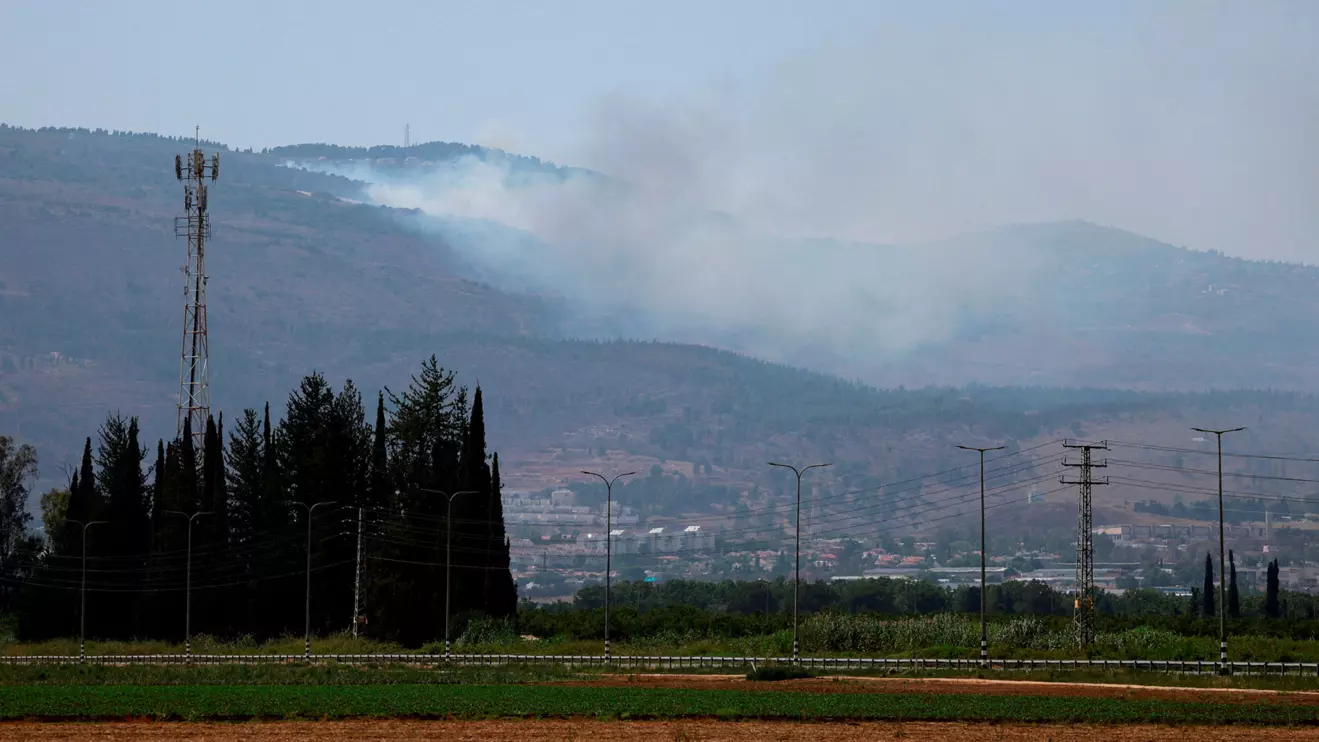 Smoke rises, amid ongoing cross-border hostilities between Hezbollah and Israeli forces, in Kiryat Shmona, northern Israel, June 14, 2024. Reuters/Ammar Awad