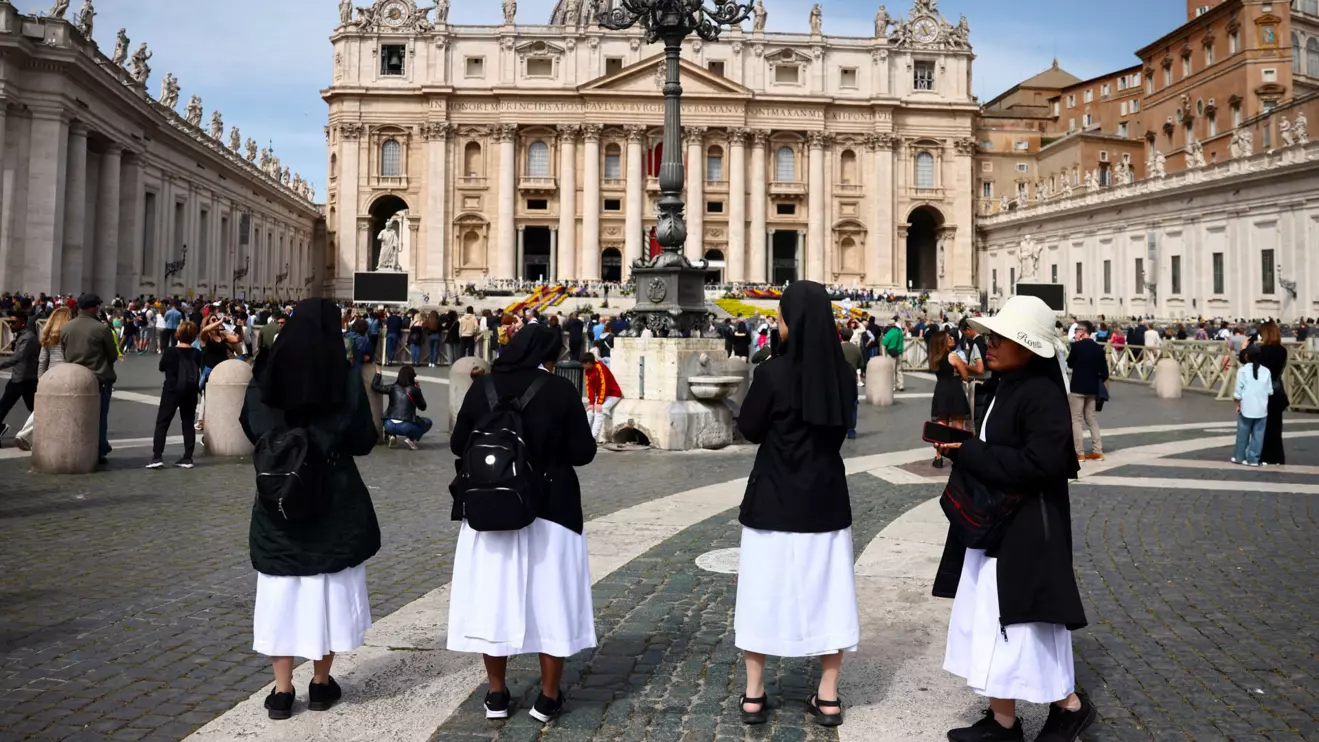 Nuns stand in St. Peter's Square, after the death of Pope Francis was announced by the Vatican in a video statement, at the Vatican, April 21, 2025. Reuters/Yara Nardi