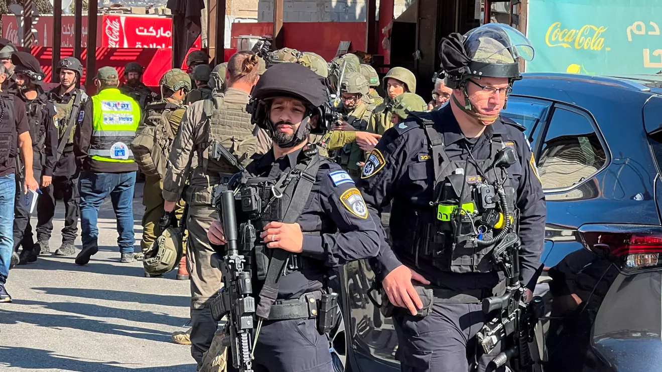 Israeli security and rescue personnel at the scene of a shooting attack on a car and bus where at least three Israelis were killed near Kedumim in the Israeli-occupied West Bank, Israel's national ambulance service Magen David Adom (MDA) said, January 6, 2025. Reuters/Rami Amichay
