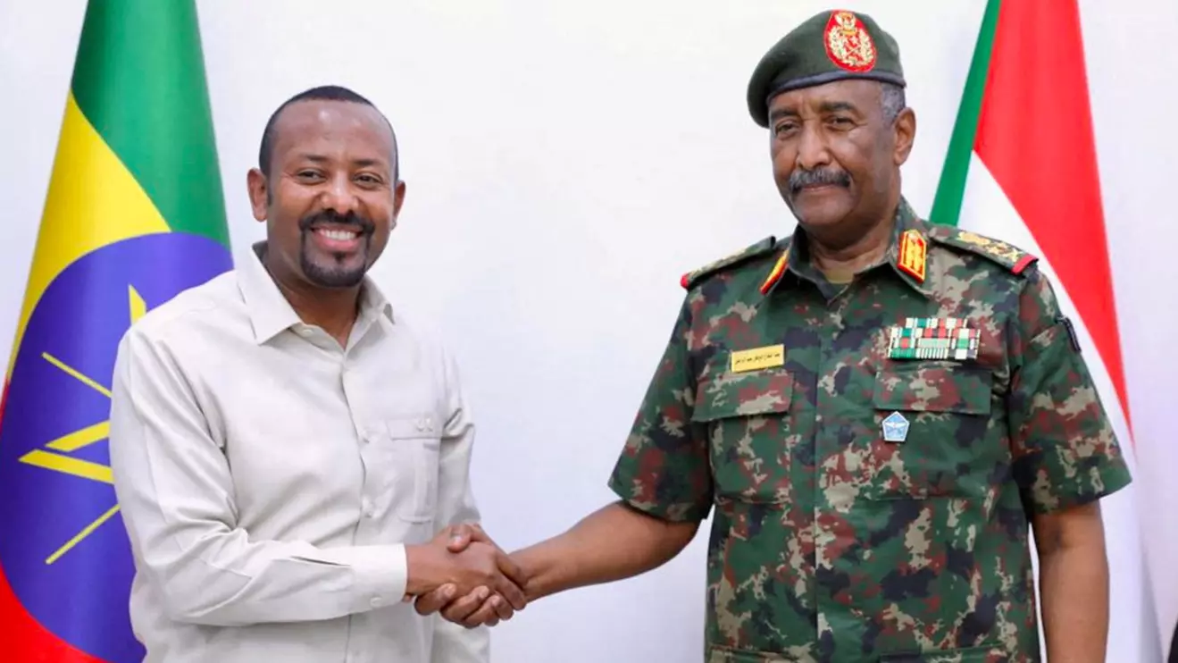 Sudan's army chief General Abdel Fattah al-Burhan meets Ethiopian Prime Minister Abiy Ahmed, in Port Sudan, Sudan, July 9, 2024. Sudanese Presidency Media Office/Handout via Reuters
