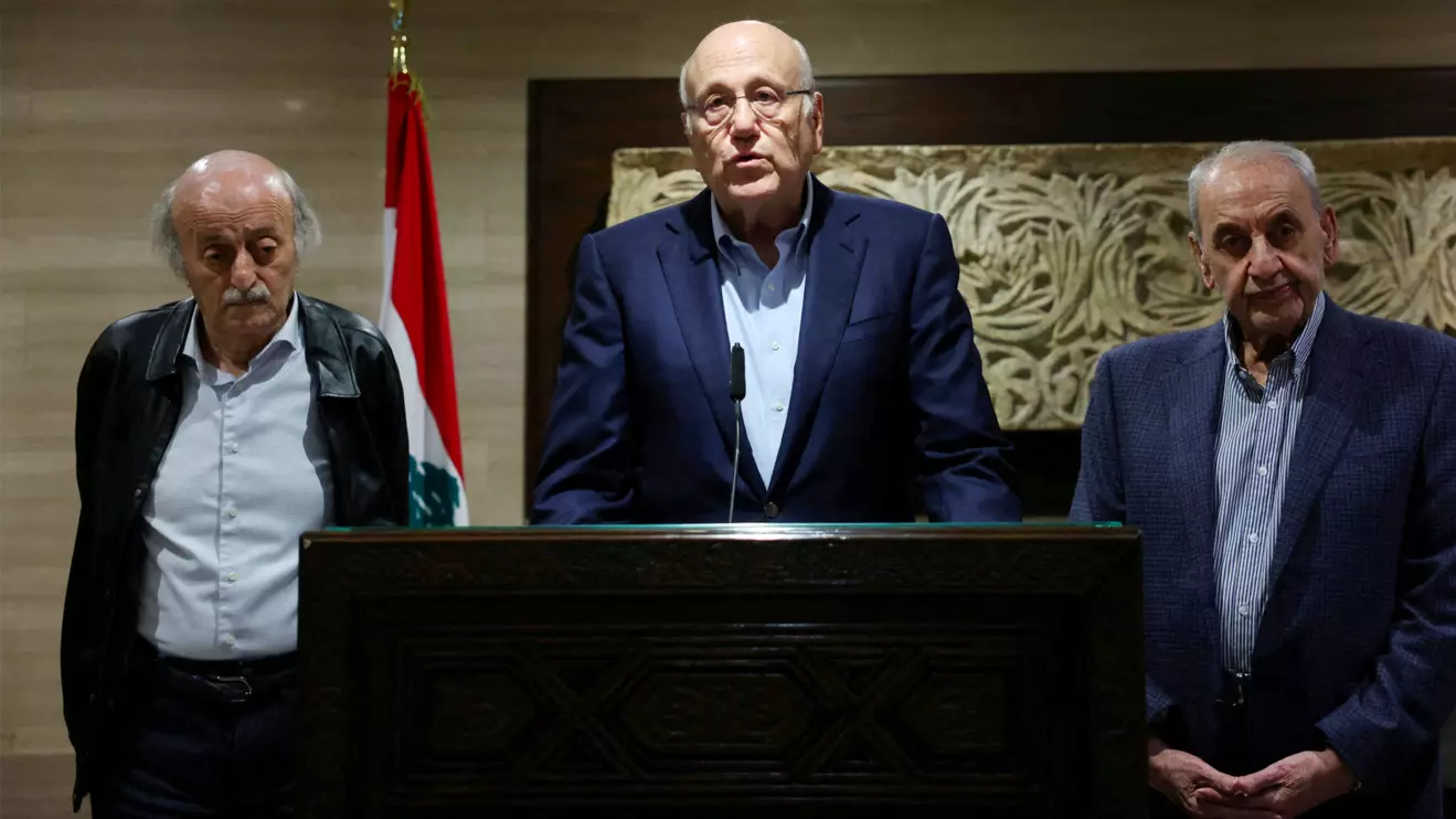 Lebanon's caretaker Prime Minister Najib Mikati stands next to Lebanese Parliament Speaker Nabih Berri, and Lebanese Druze leader Walid Jumblatt, as he speaks during a press conference in Beirut, Lebanon October 2, 2024. Reuters/Mohamed Azakir