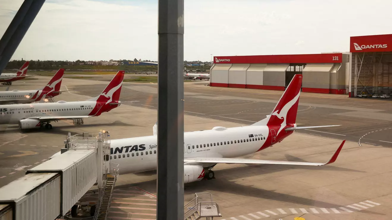 Qantas planes are seen at a domestic terminal at Sydney Airport in Sydney, Australia, November 16, 2020. Reuters/Loren Elliott