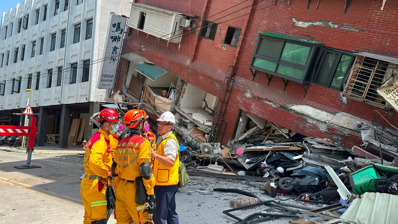 Firefighters work at the site of a collapsed building in Hualien, April 3, 2024. Taiwan National Fire Agency