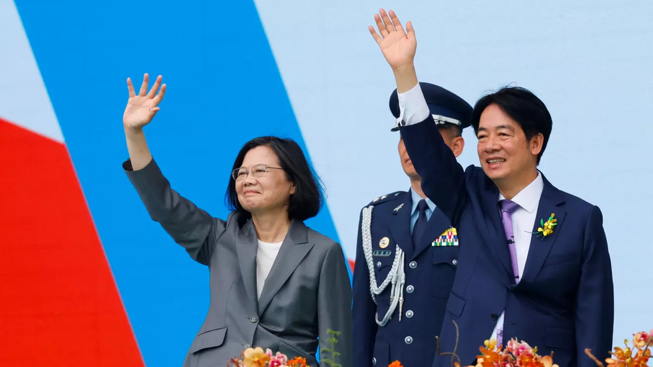 Taiwan's former President Tsai Ing-wen and new President Lai Ching-te wave to people during the inauguration ceremony outside the Presidential office building in Taipei, Taiwan May 20, 2024. Reuters/Carlos Garcia Rawlins