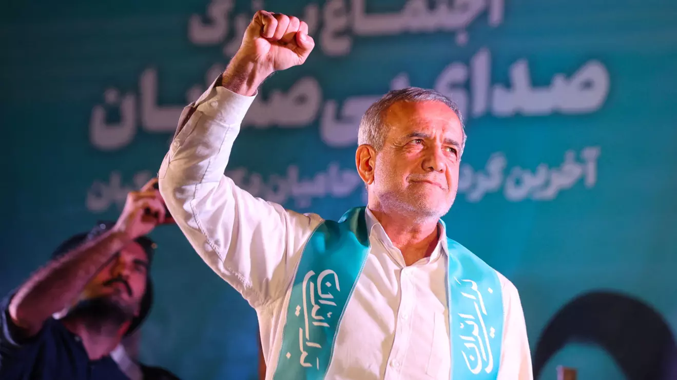 Iranian presidential candidate Masoud Pezeshkian waves during a campaign event in Tehran, Iran, July 3, 2024. Majid Asgaripour/WANA (West Asia News Agency) via Reuters