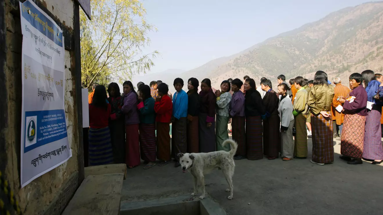 Bhutanese voters stand in a queue outside a polling station, Reuters/Desmond Boylan/File Photo