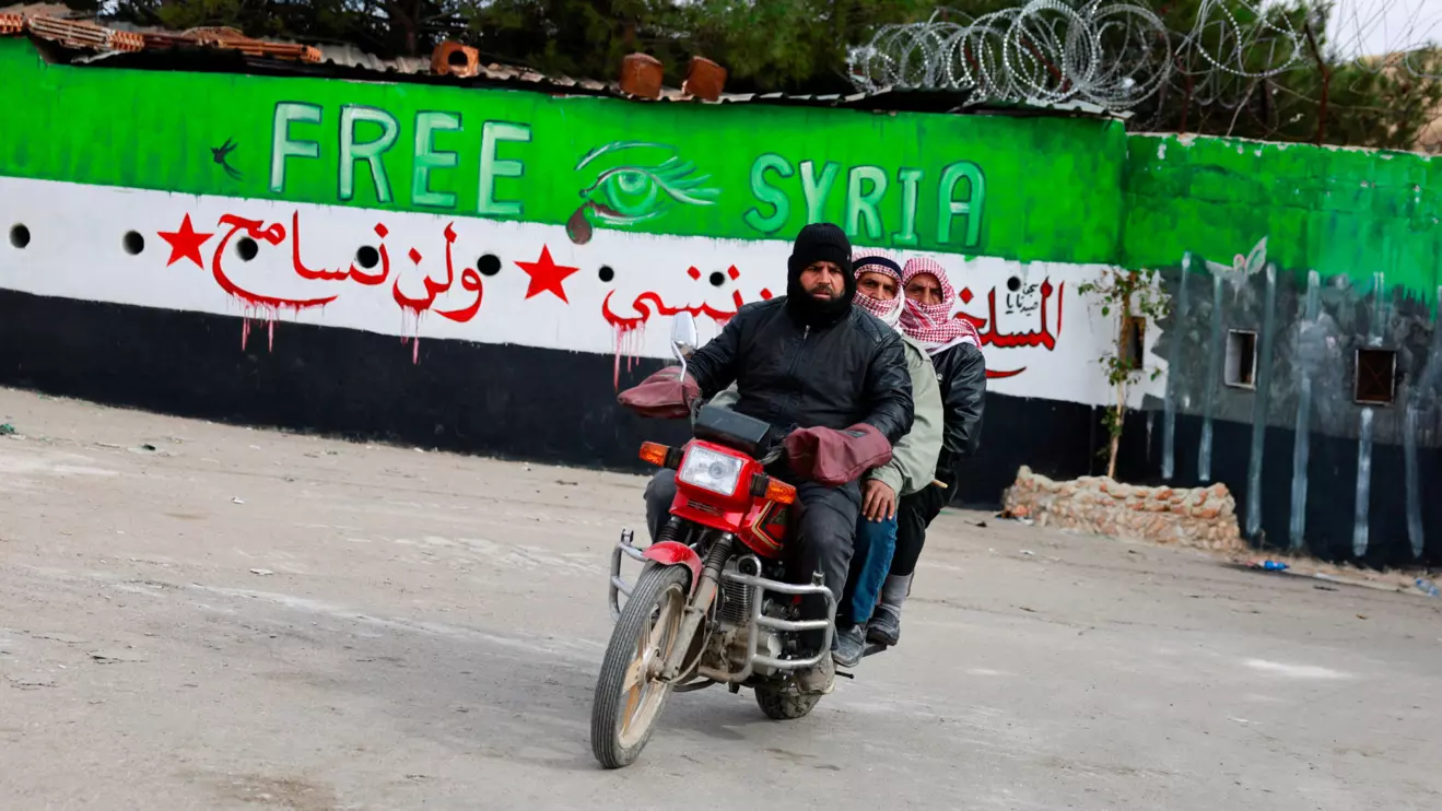 Men ride a bike outside Sednaya prison, after rebels seized the capital and announced that they have ousted President Bashar al-Assad, in Sednaya, Syria December 11, 2024. Reuters/Ammar Awad