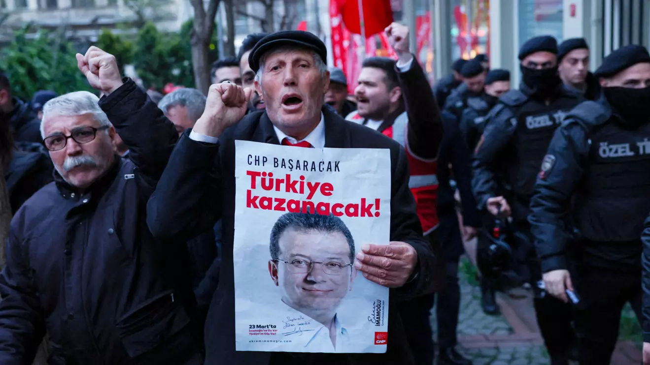 A man holds a poster with a picture of Istanbul Mayor Ekrem Imamoglu during a rally to protest against the arrest of Imamoglu as part of a corruption investigation, in Istanbul, Turkey, April 9, 2025. Reuters/Dilara Senkaya
