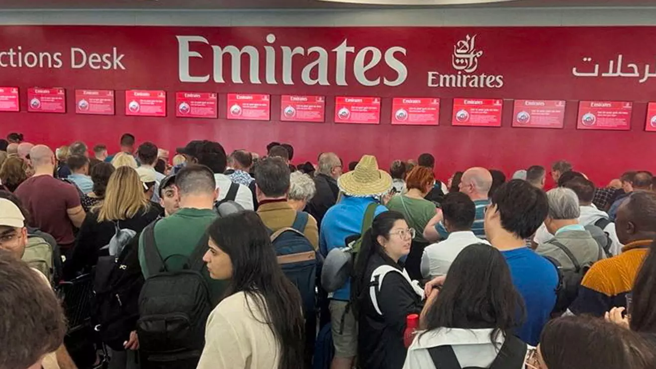 People queue at a flight connection desk after a rainstorm hit Dubai, causing delays at the Dubai International Airport, United Arab Emirates, April 17, 2024. Reuters