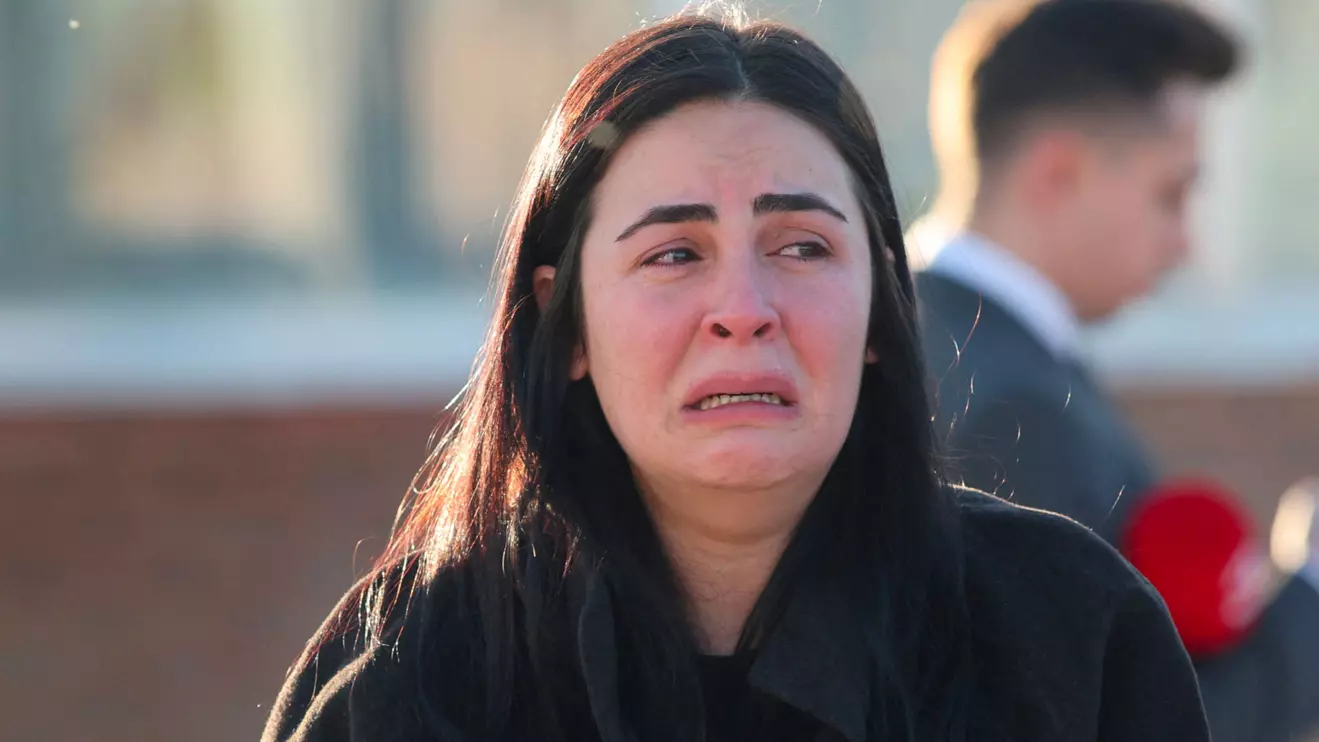 A woman reacts at the entrance of the headquarters of Turkey's aviation company TUSAS, where three people were killed and five others wounded in an attack, near Kahramankazan, a town of Turkish capital Ankara, October 23, 2024. Reuters