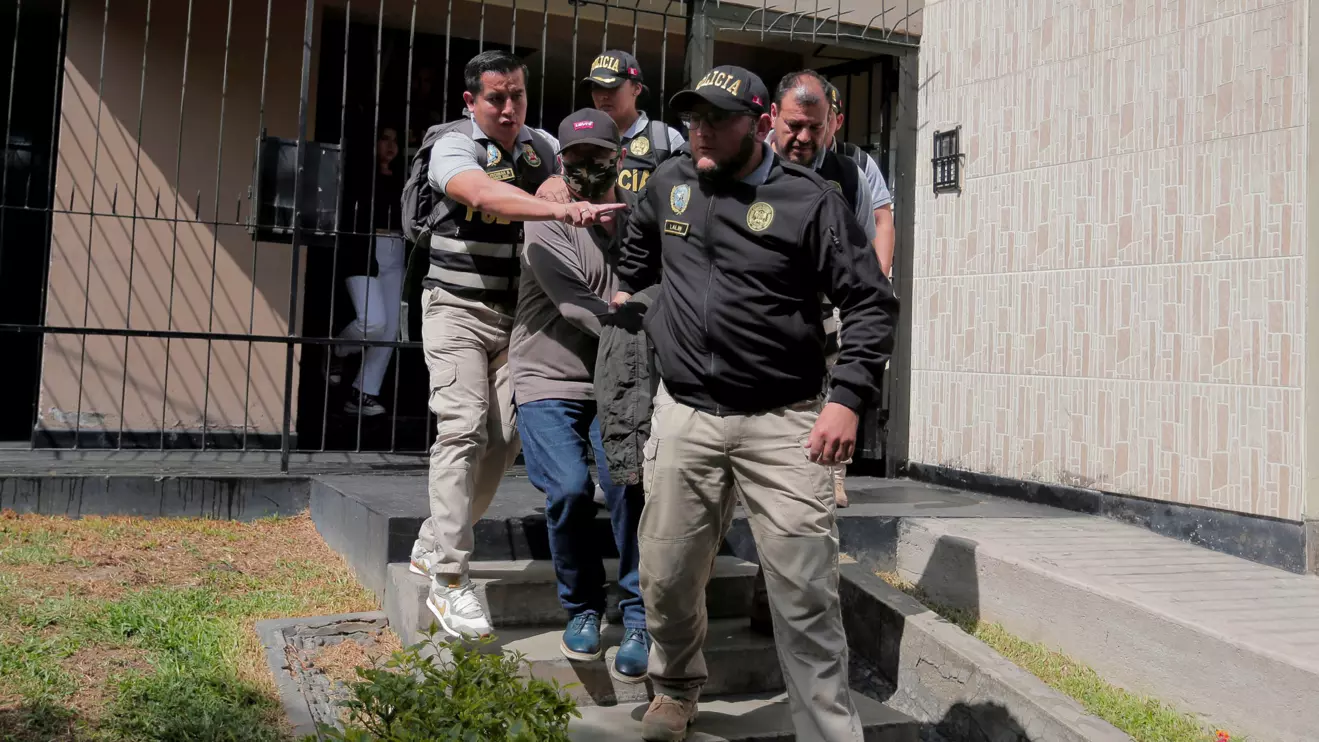 Police officers escort Nicanor Boluarte, brother of Peruvian President Dina Boluarte, as he leaves his home, after prosecutors detained him for allegedly being part of a group that trafficked influence, according to the Attorney General's Office, in Lima, May 10, 2024. Reuters/Gerardo Marin
