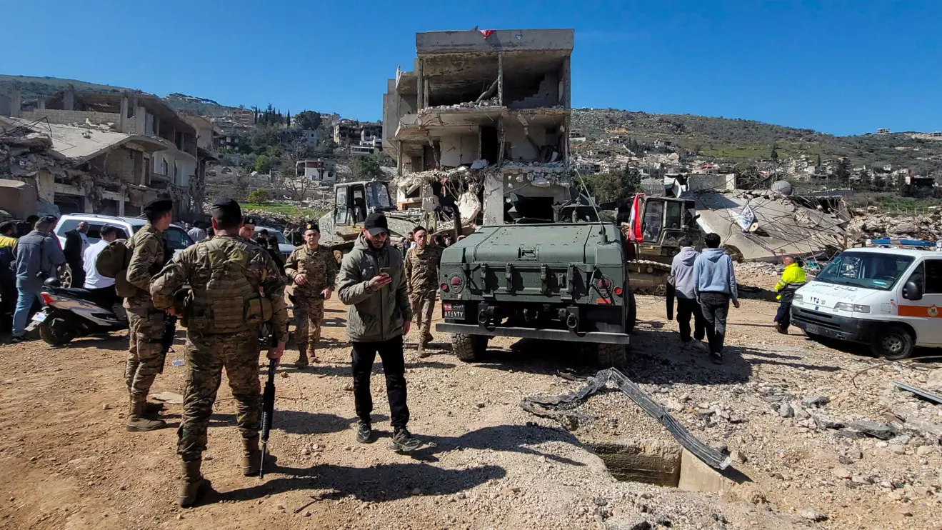 Lebanese army members and residents inspect the damages in the southern Lebanese village of Kfar Kila, Lebanon February 18, 2025. Reuters/Karamallah Daher