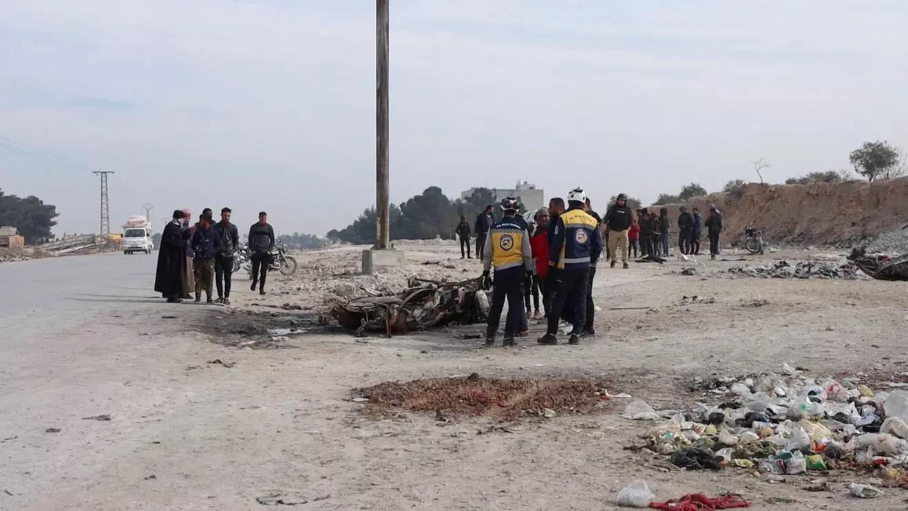 Members of the White Helmets work in the aftermath of a car bomb explosion, in Manbij, Syria, February 3, 2025, in this screen grab taken from a video. The White Helmets/Handout via Reuters