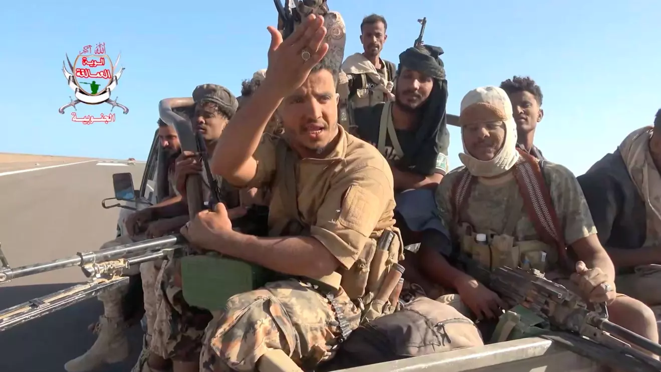 Pro-Saudi-backed Yemeni government fighters sit in the back of a vehicle during what government forces say was an advance against the Iran-backed Houthis, near Dhubab, Taiz Governorate, Yemen, in this still image taken from video released October 5, 2026. Southern Giants Brigades