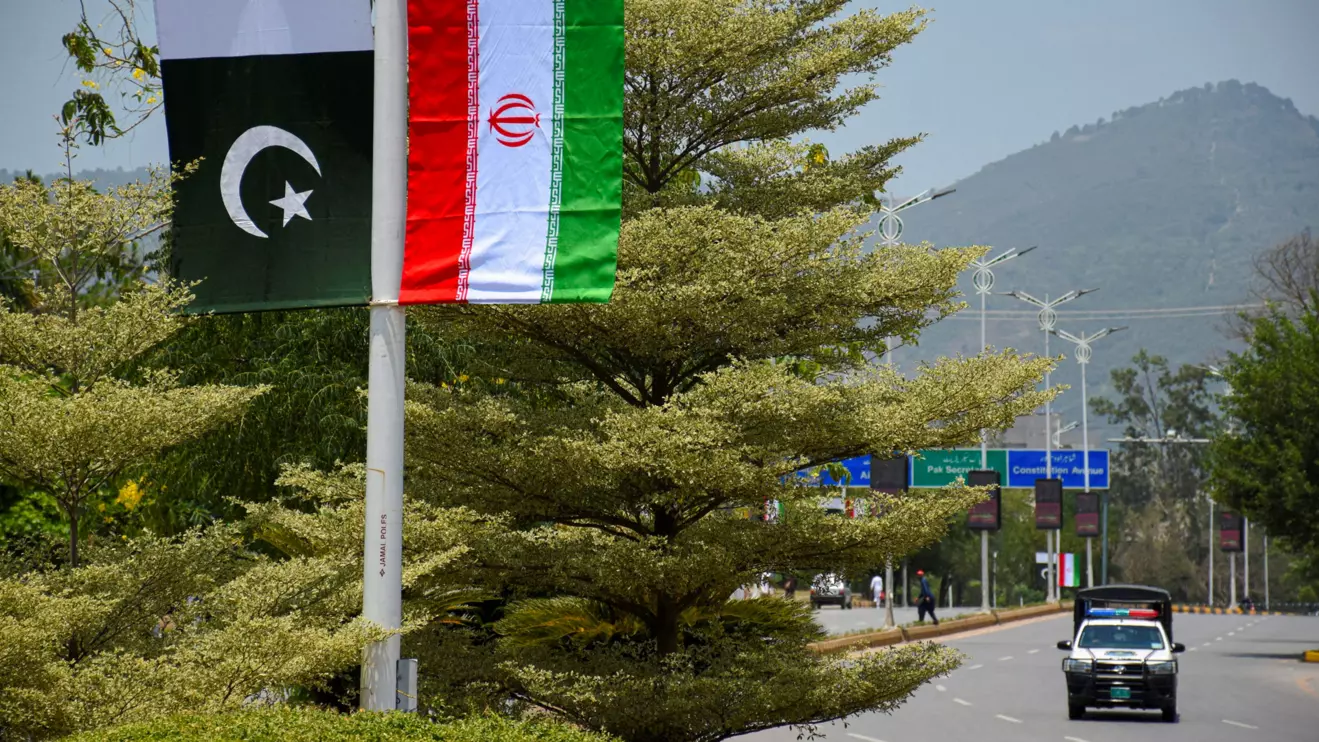 Iranian and Pakistani national flags are displayed along a street ahead of the arrival of Iran's President Masoud Pezeshkian in Islamabad, Pakistan, June 23, 2026. Reuters/Waseem Khan