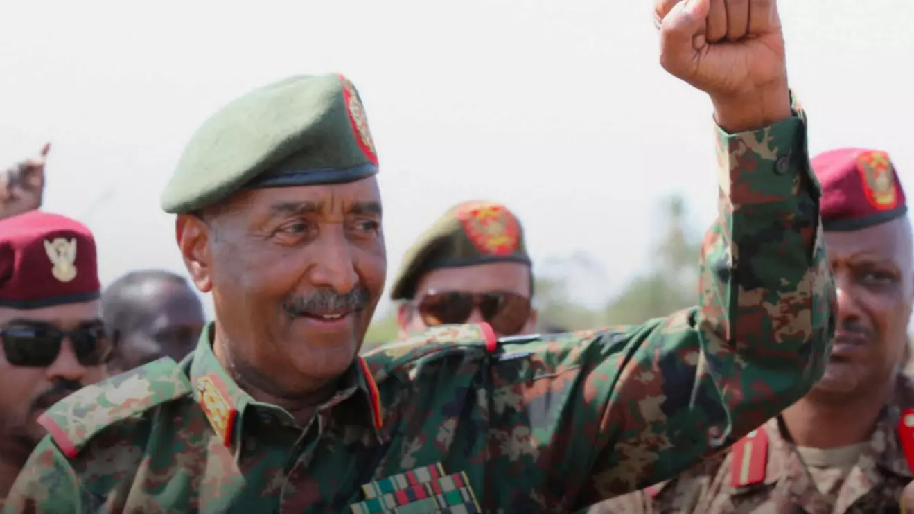 Sudan's army chief Abdel Fattah al-Burhan gestures to soldiers inside the presidential palace after the Sudanese army said it had taken control of the building, in the capital Khartoum, Sudan March 26, 2025. Sudan Transitional Sovereignty Council/Handout via Reuters