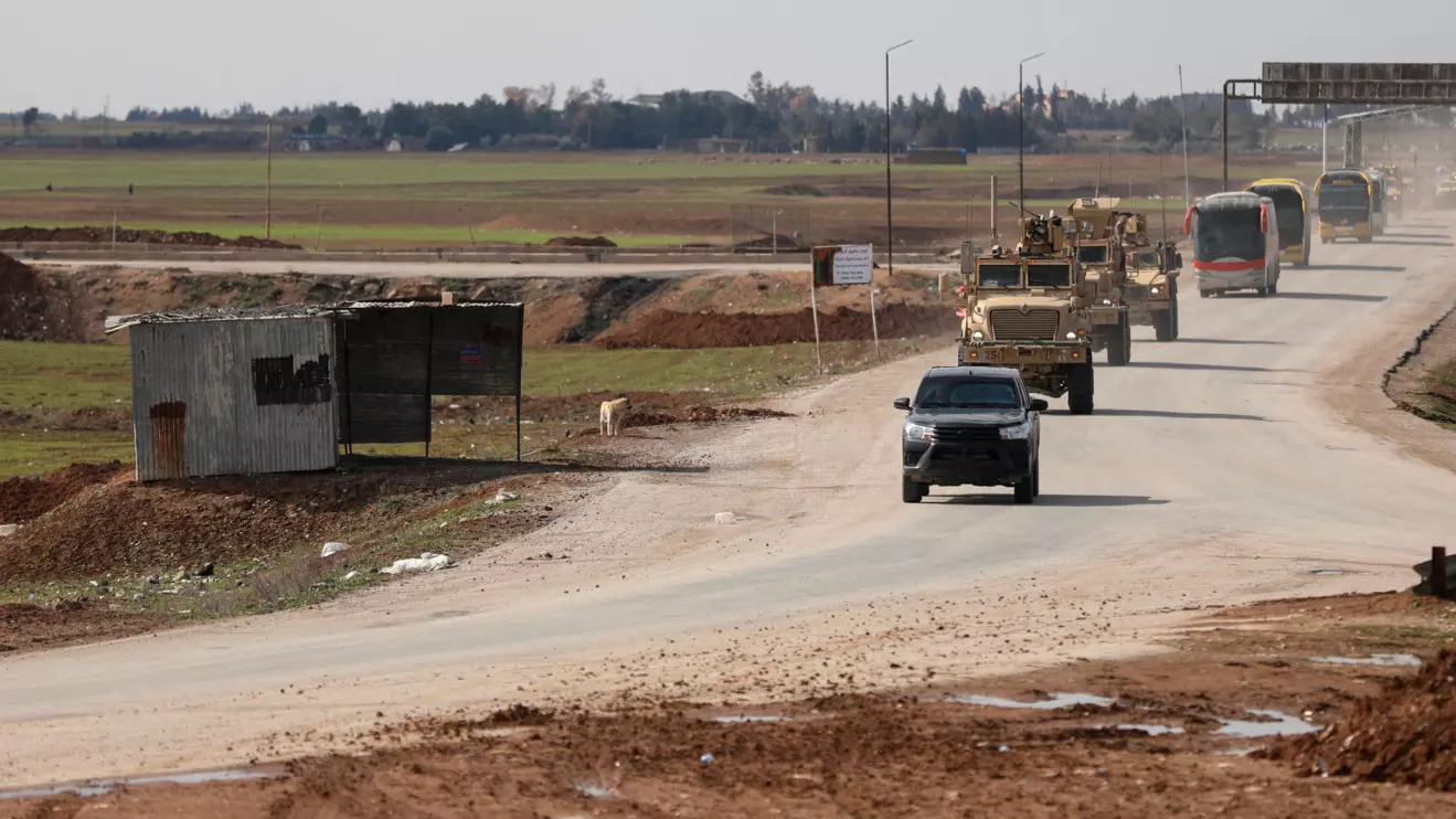 U.S. military vehicles move ahead of buses transporting Islamic State detainees from Syria to Iraq, according to a security source from the Syrian Democratic Forces, in Qamishli, Syria. Reuters/Orhan Qereman