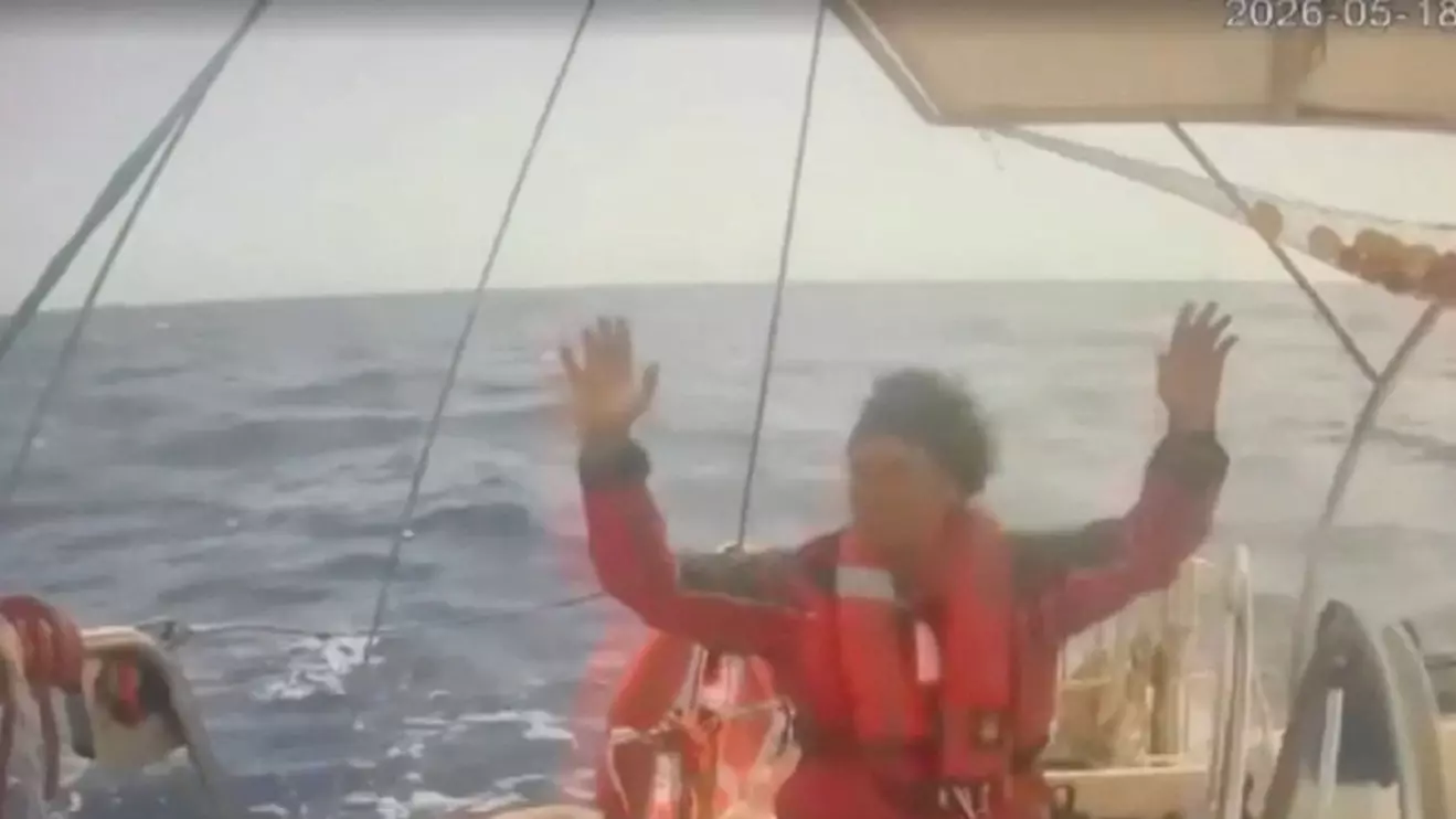 A person raises his hand as an Israeli naval boat intercepts the Global Sumud Flotilla en route to Gaza, in an attempt to deliver aid, at sea May 18, 2026, in this screengrab taken from a handout video