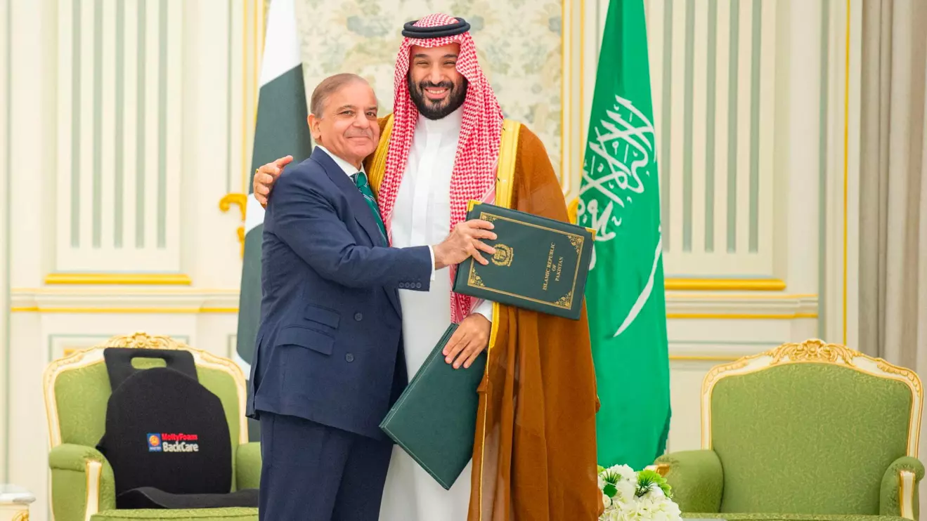 Saudi Crown Prince Mohammed bin Salman and Pakistan Prime Minister Shehbaz Sharif embrace each other on the day they sign a defence agreement, in Riyadh, Saudi Arabia, September 17, 2025. Saudi Press Agency