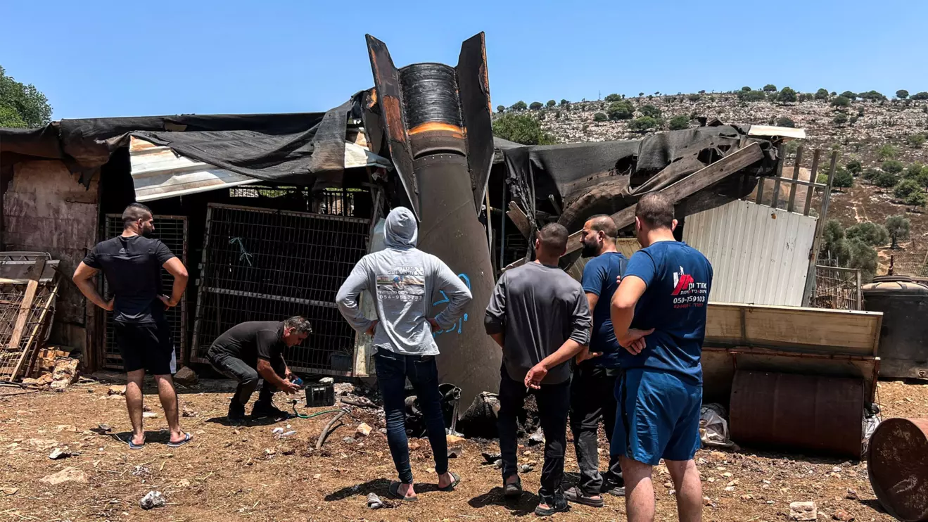 People look at an apparent remains of a ballistic missile following today's missile attack by Iran on Israel, in northern Israel, June 24, 2025. Reuters/Avi Oha