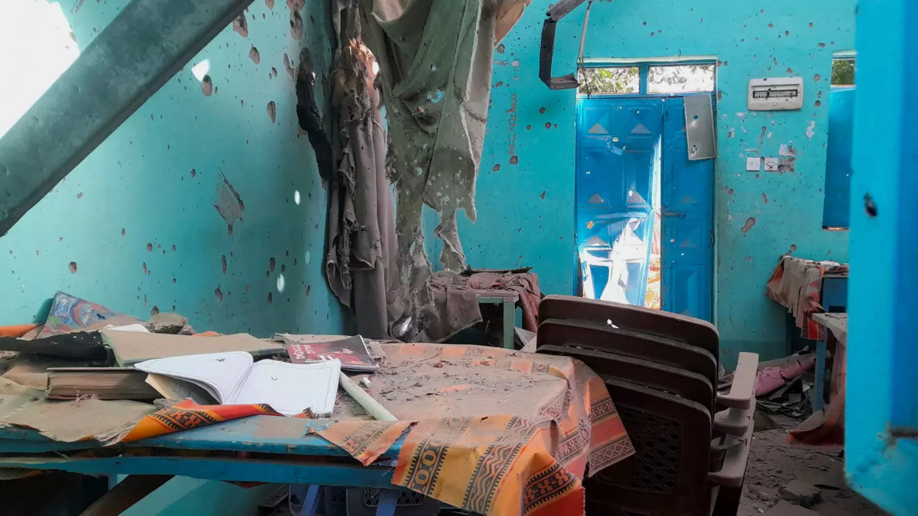 A desk bearing signs of shelling in a school where displaced people are sheltering, in El Fasher, Sudan, October 7, 2025. Reuters/Mohyaldeen M Abdallah