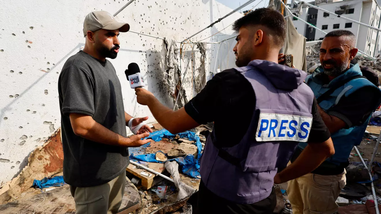 A Palestinian man speaks to members of the media at the site of an Israeli strike on a tent near Shifa Hospital where Al Jazeera journalists Anas Al Sharif, Mohammed Qreiqeh, Ibrahim Zaher, and Mohammed Noufal were killed, in Gaza City August 11, 2025. Reuters/Mahmoud Issa